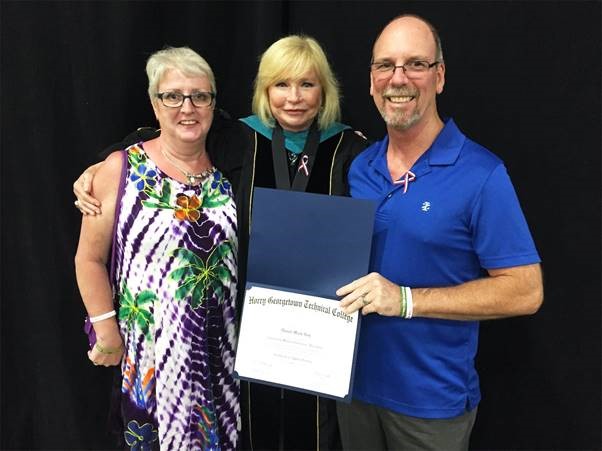 PresidentFore with Sue and Mark Roy, parents of Daniel Roy. President Fore presented a posthumous degree for Daniel Royat HGTC’s 2019 Commencement.