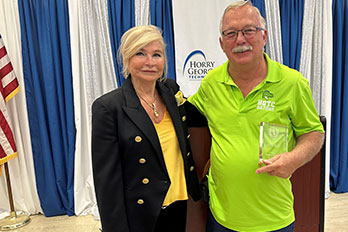 Art Gray poses with Dr. Fore