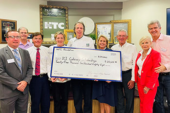 people attending a check presentation