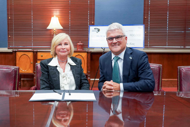 Dr. Marilyn “Murph” Fore, president of Horry-Georgetown Technical College (left), and Dr. James Winebrake, president of Coastal Carolina University (right), sign the new transfer agreement creating a Criminal Justice program pathway between HGTC and CCU.
