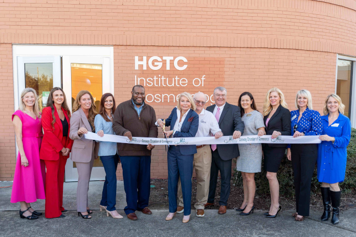 Dr. Marilyn “Murph” Fore (center), president of HGTC, cuts the ribbon during the grand opening of the College’s newly expanded Institute of Cosmetology on the Conway Campus. HGTC Area Commissioners Tommy Branyon (right) and Fedrick Cohens (left), along with other College leaders, celebrate the milestone and continued investment.
