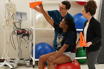 Student working with patient